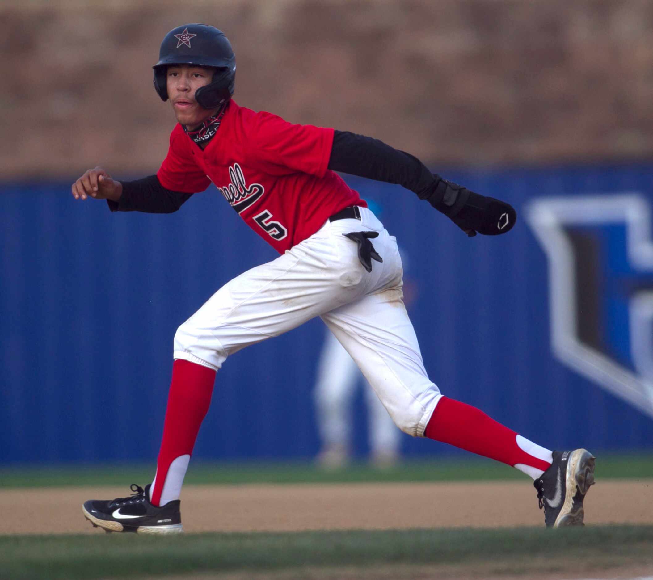 Coppell base runner TJ Pompey (5) breaks from first base before changing his mind during the...