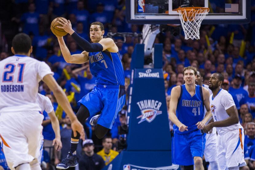 Dallas Mavericks forward Dwight Powell (7) jumps up for a rebound during the fourth quarter...