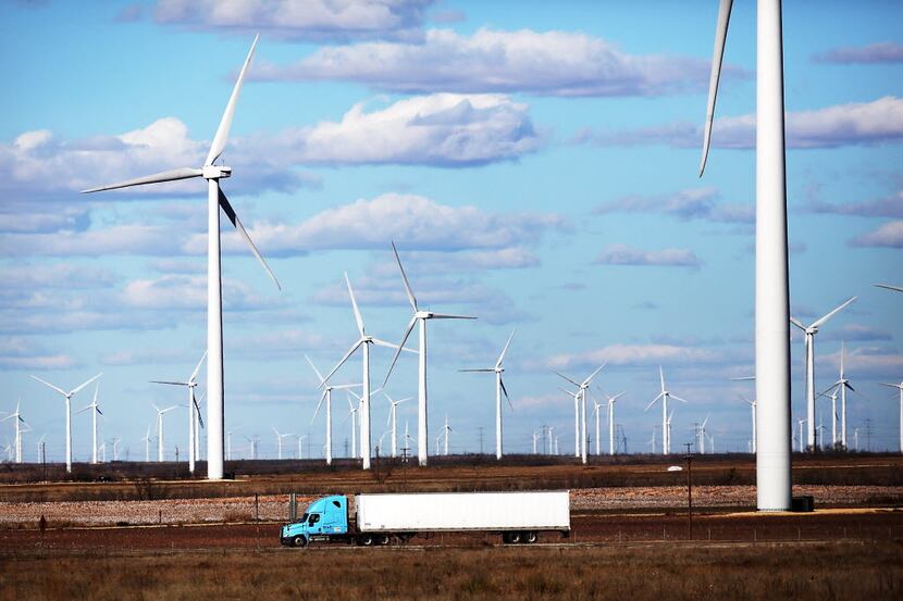 Wind turbines spin at a wind farm in Colorado City, Texas. 