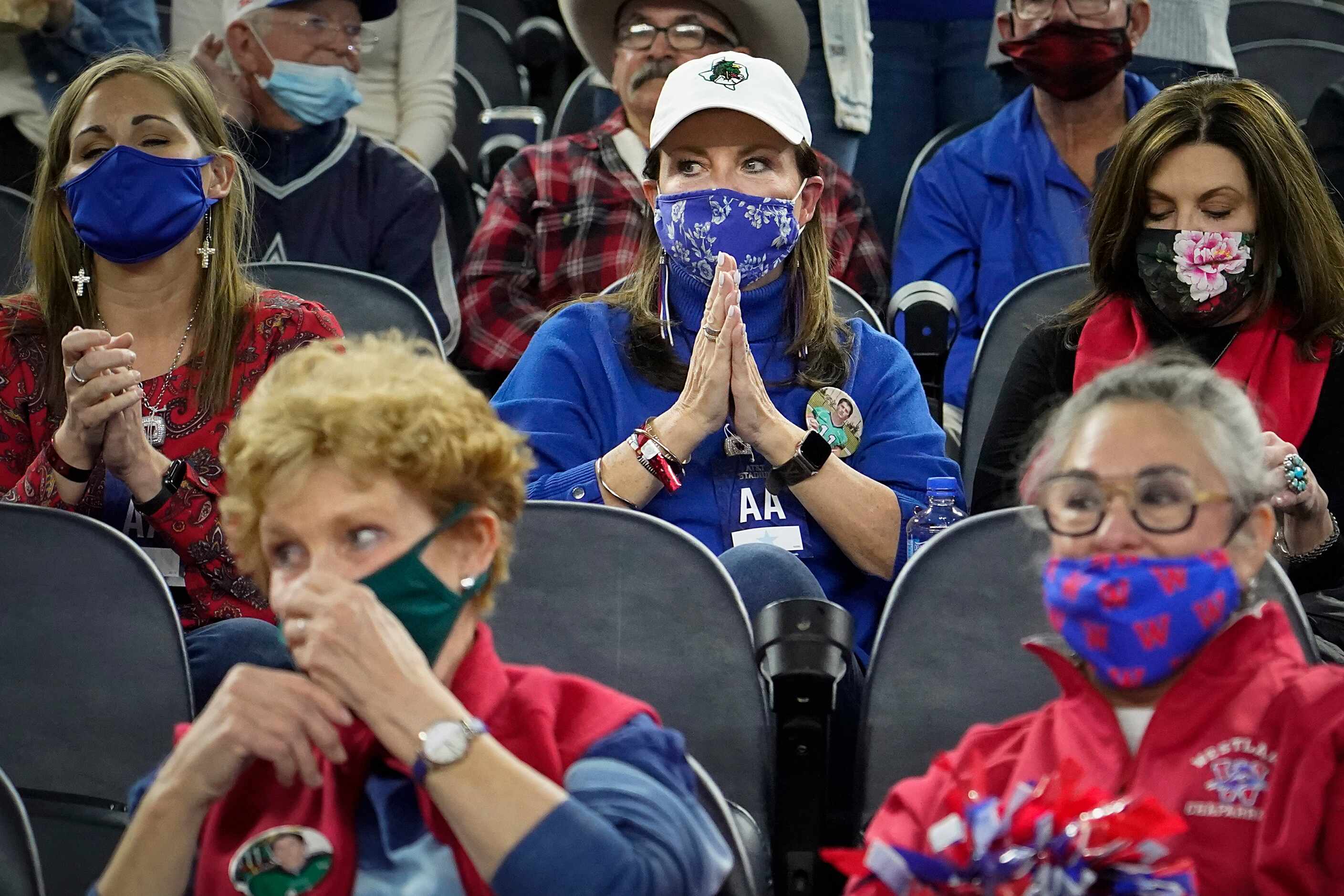 Elizabeth Dodge sits in the Westlake section and wears the team colors colors, but also...