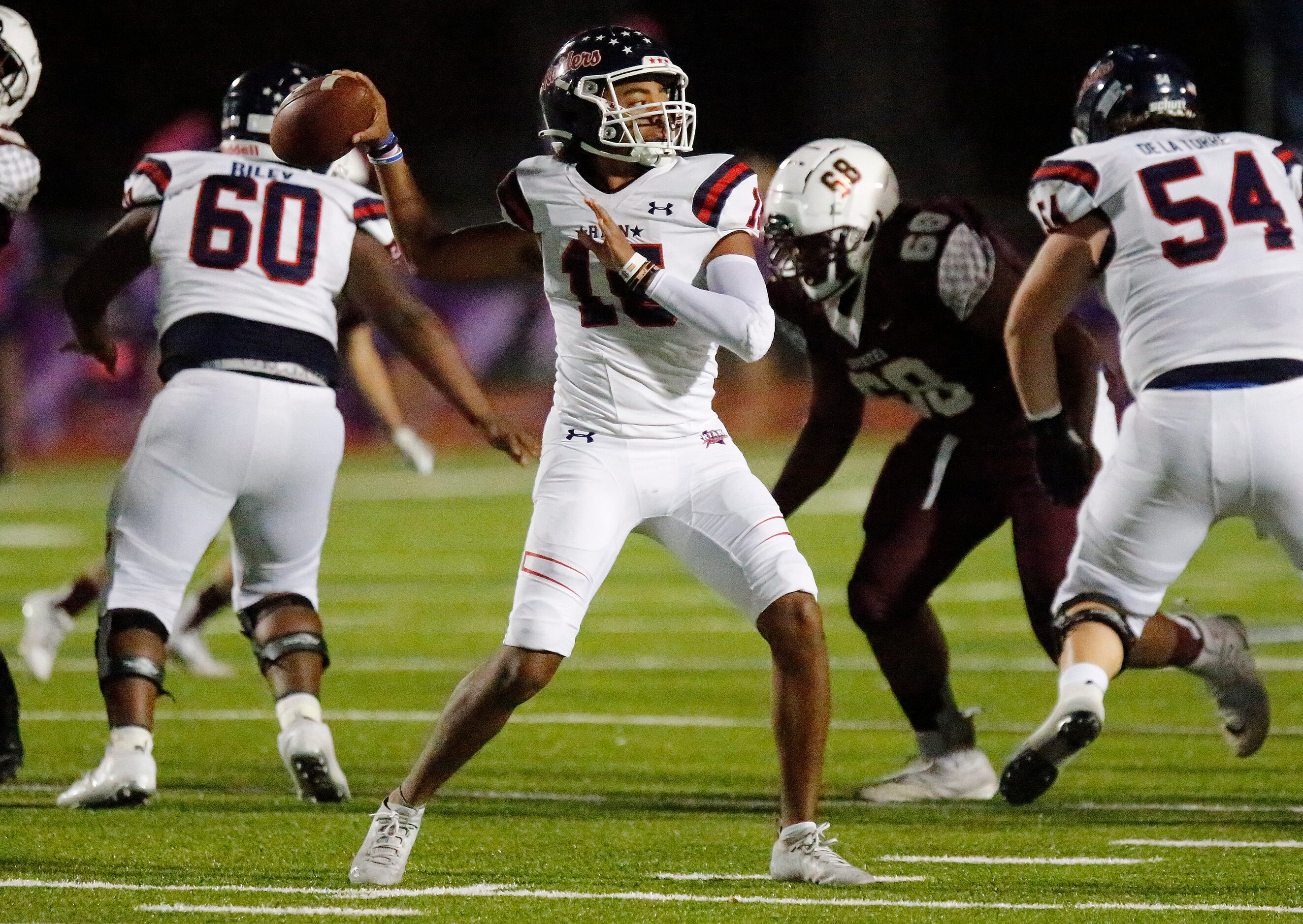 Denton Ryan High School quarterback Khalon Davis (15) throws a pass during the first half as...