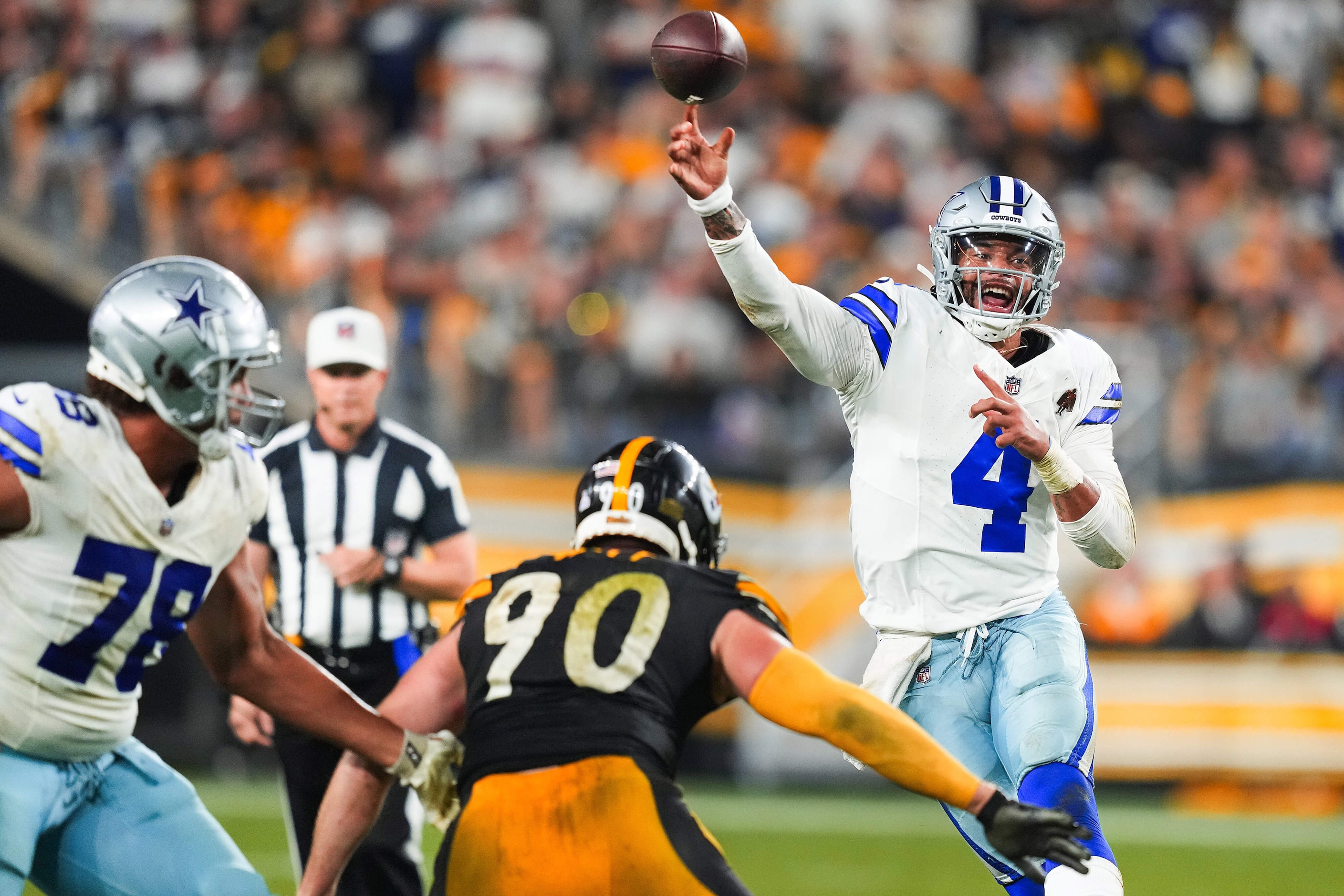 Dallas Cowboys quarterback Dak Prescott (4) fires a pass over Pittsburgh Steelers linebacker...