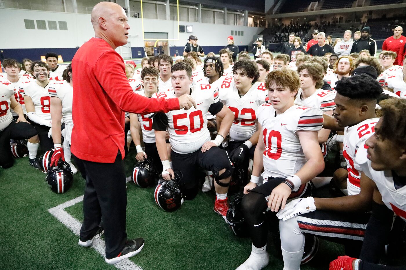 Lovejoy High School head coach Chris Ross addresses his team after their victory as Lovejoy...