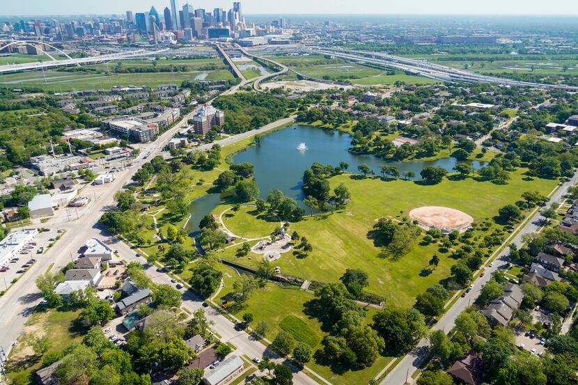 Aerial view of a Lake Cliff Park (bottom) with the downtown skyline on Thursday, April 16,...