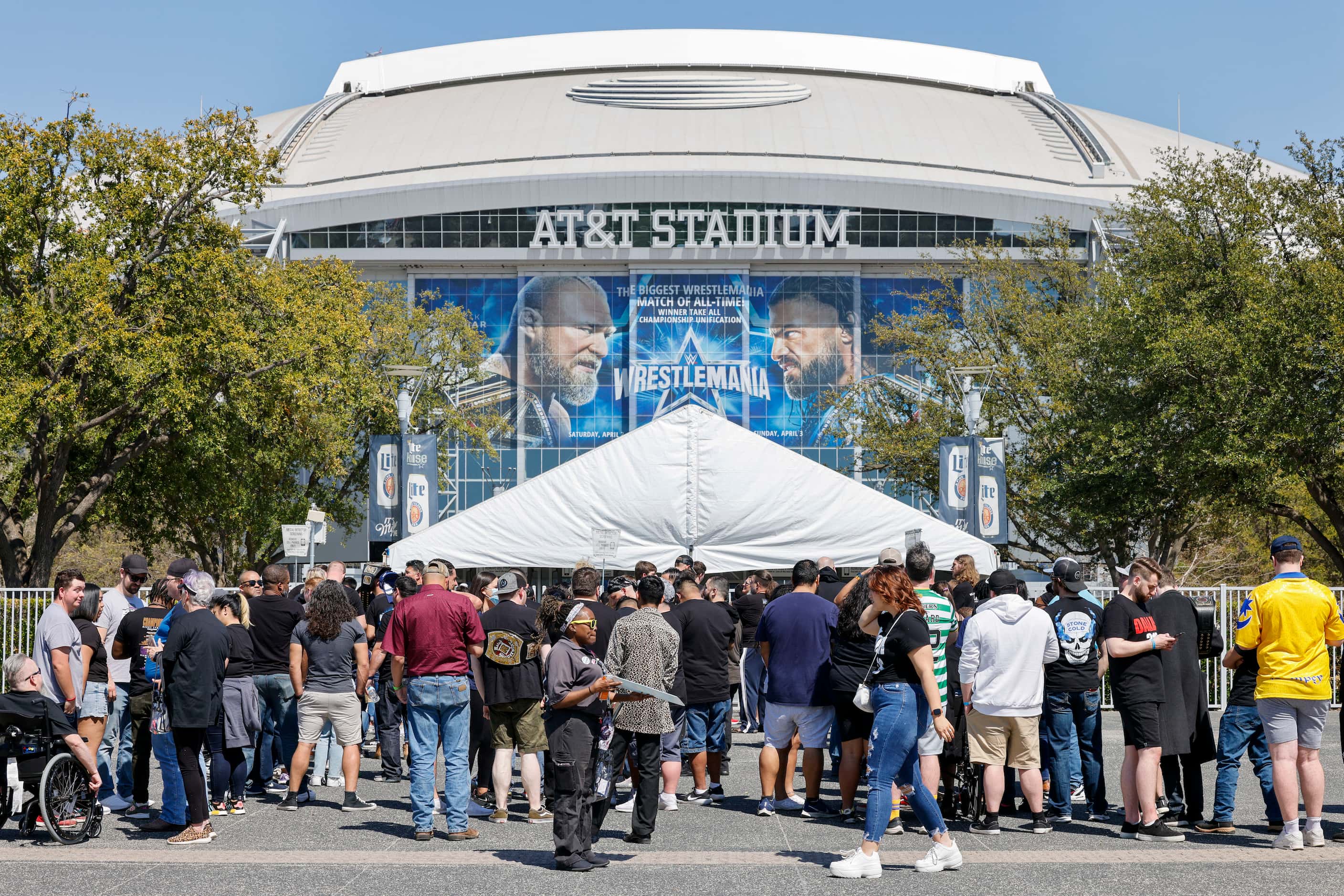Wrestling fans outside AT&T Stadium before WrestleMania 38 in Arlington, Texas, Saturday,...