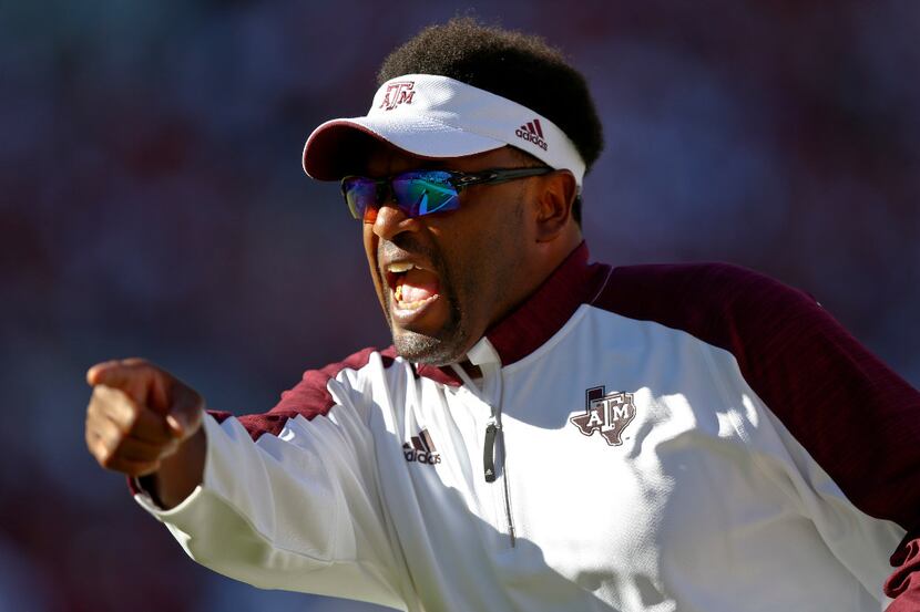 FILE - In this Saturday, Oct. 22, 2016, file phot, Texas A&M head coach Kevin Sumlin yells...