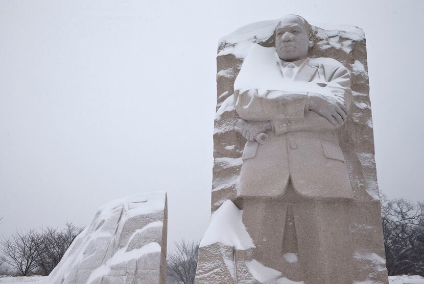  The Martin Luther King, Jr. Memorial is seen with a coating of snow, Saturday, Jan. 23,...