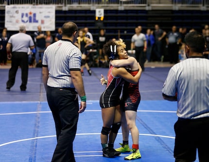 Euless Trinity's Mack Beggs hugs Tascosa's Mya Engert after winning 12-4 in the 6A girls 110...