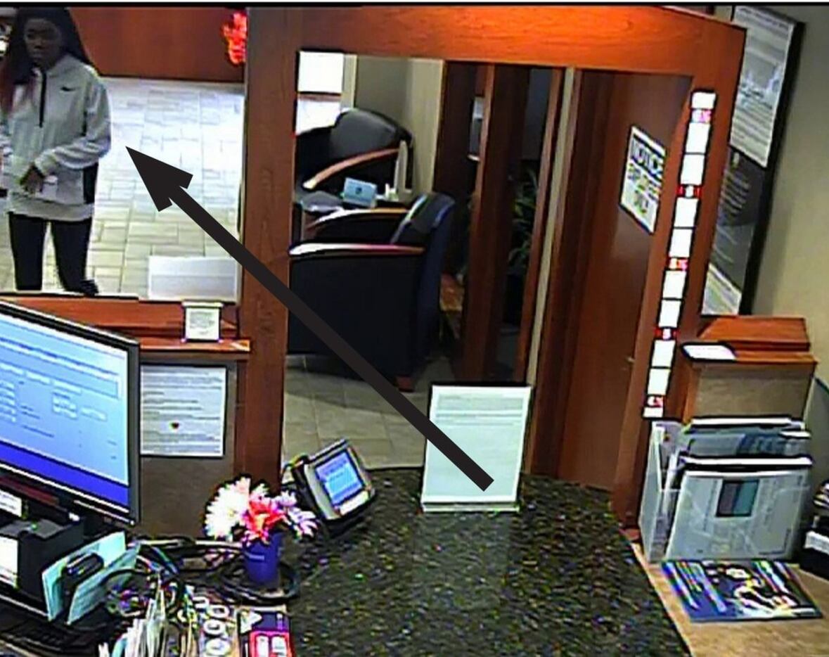 Arlington police released surveillance footage of a woman who robbed the BBVA Compass bank...