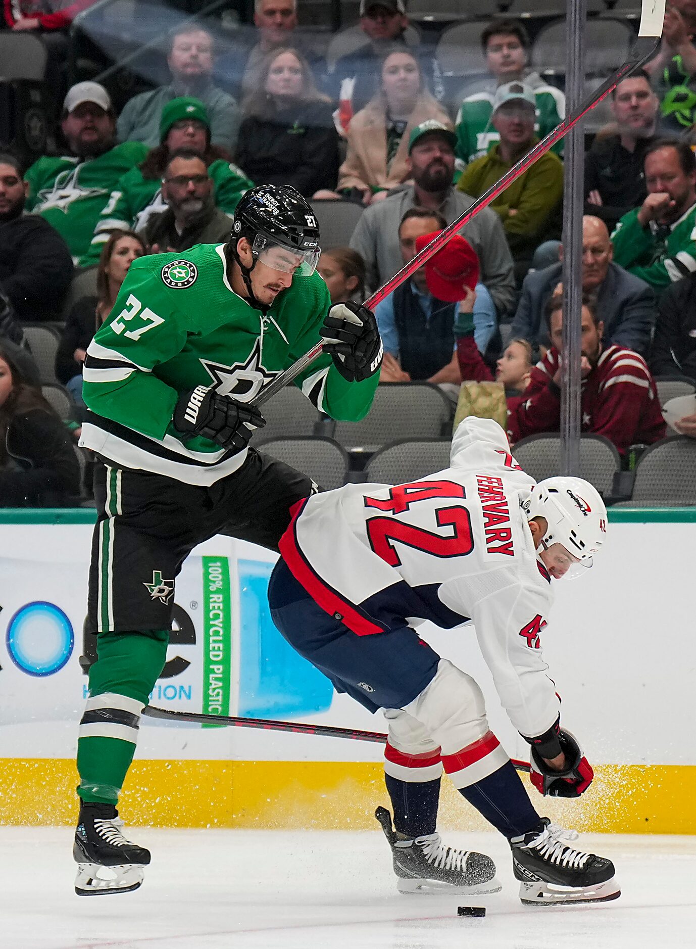 Dallas Stars left wing Mason Marchment (27) gets tied up with Washington Capitals defenseman...