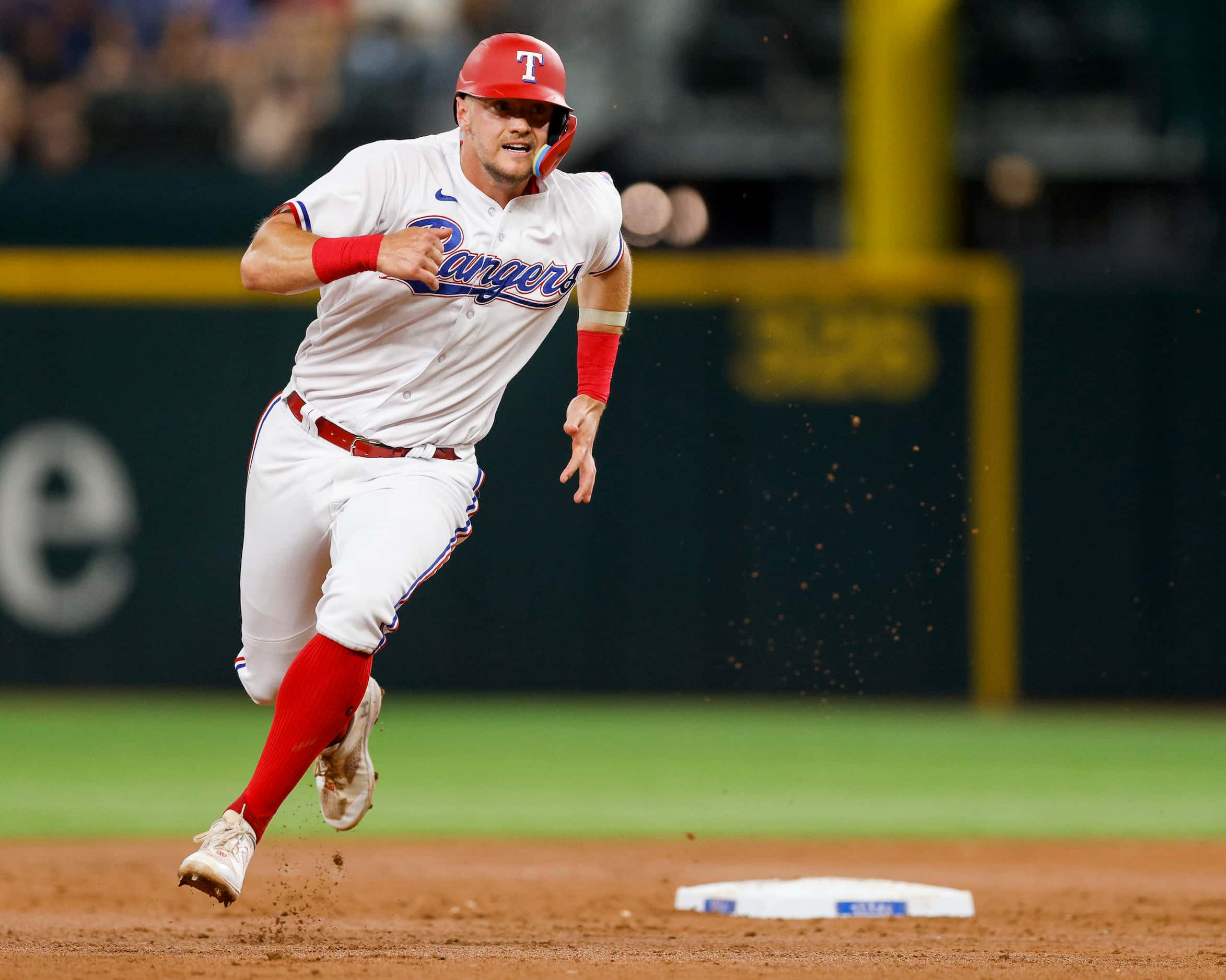 Texas Rangers third baseman Josh Jung (6) rounds second base as he scores a run in the...