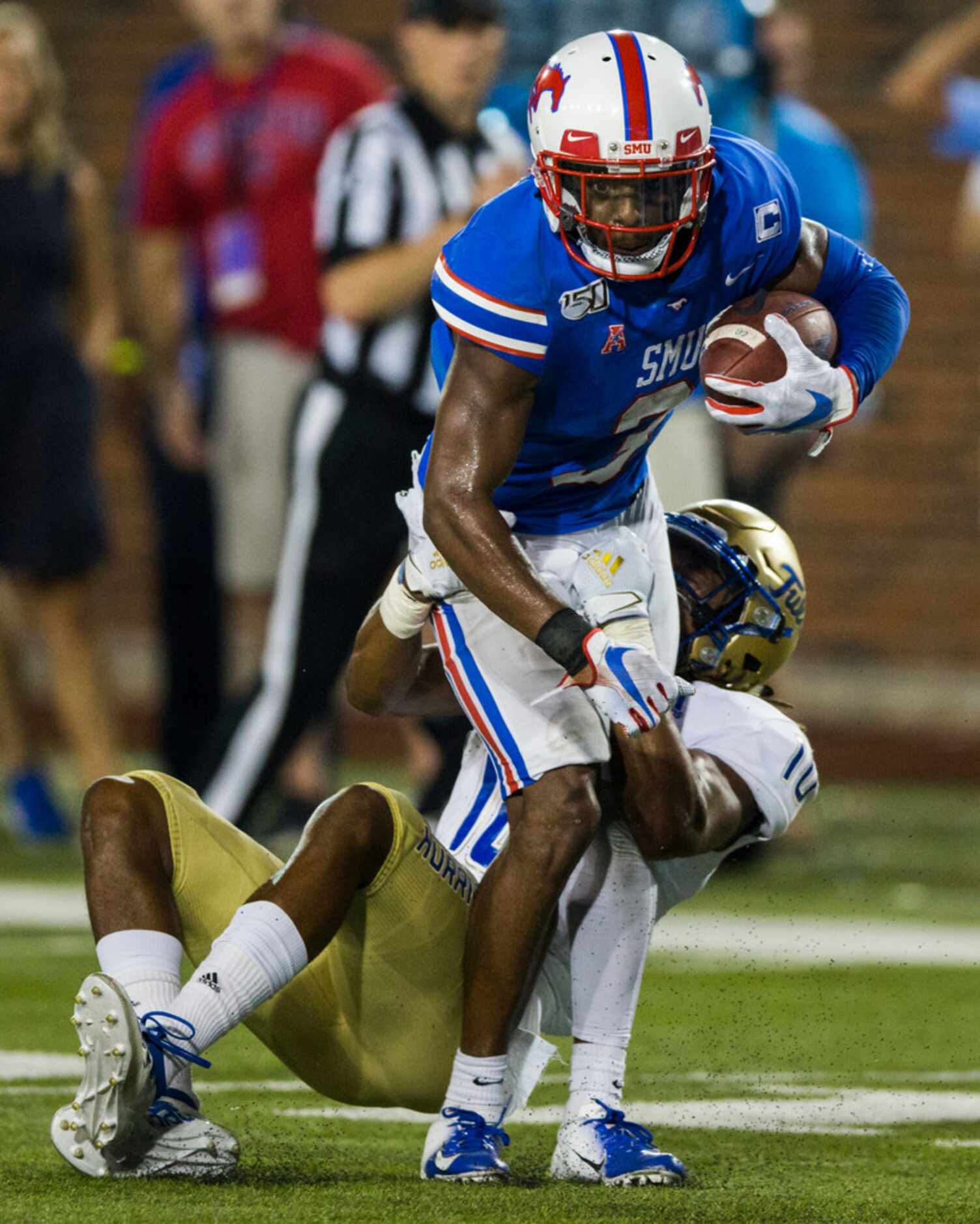 SMU Mustangs wide receiver James Proche (3) is tackled by Tulsa Golden Hurricane safety...