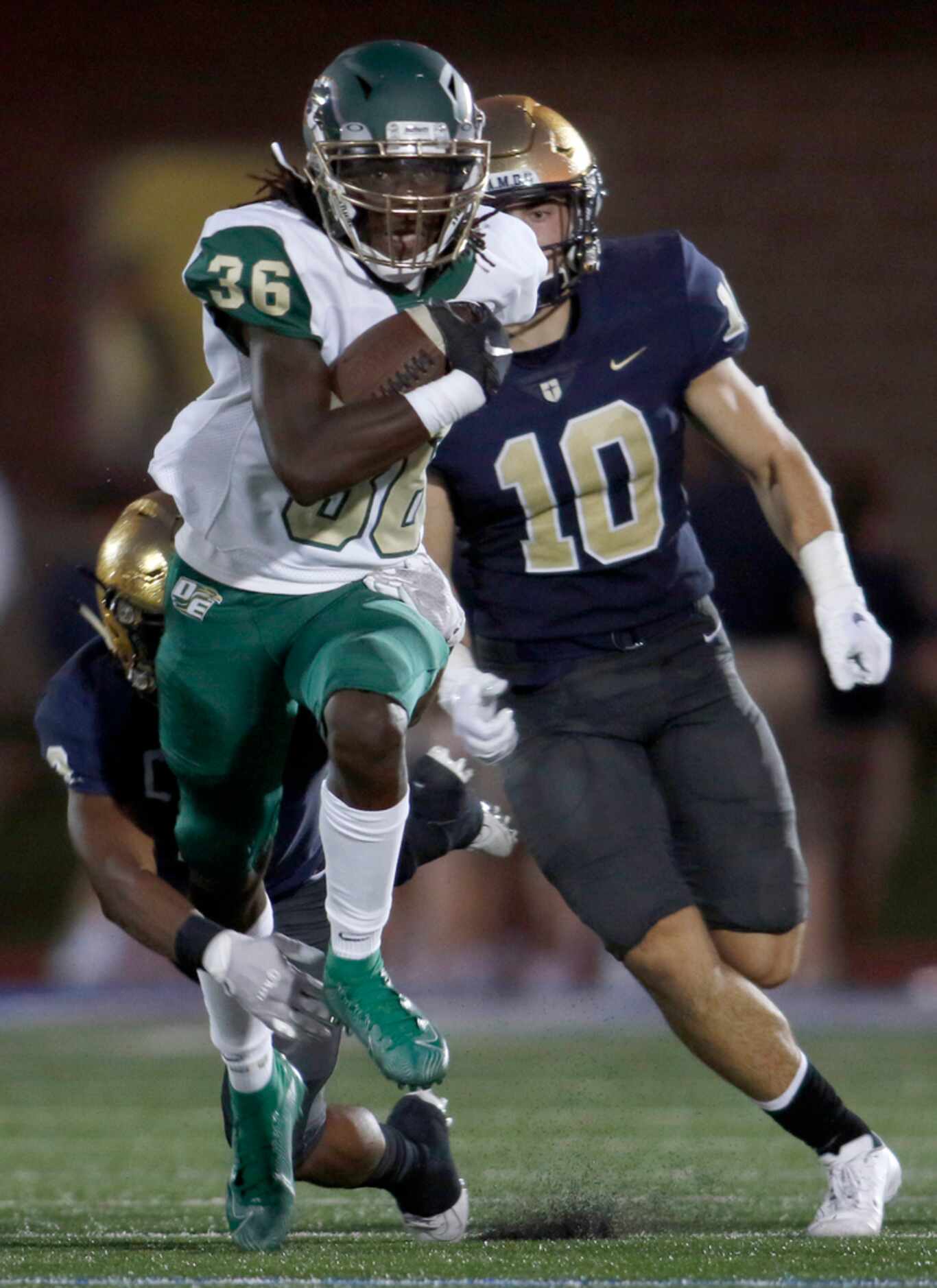 DeSoto running back Robert Richardson (36) rambles deep into the Jesuit secondary as he is...