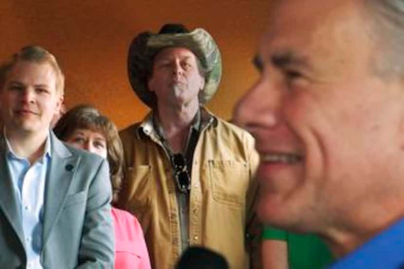

Ted Nugent (center), known for calling feminists and female politicians “dirty whores,”...