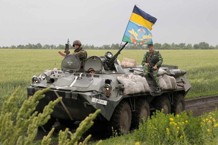 Ukrainian army paratroopers move to position in Slovyansk, Ukraine, Saturday, May 31,...