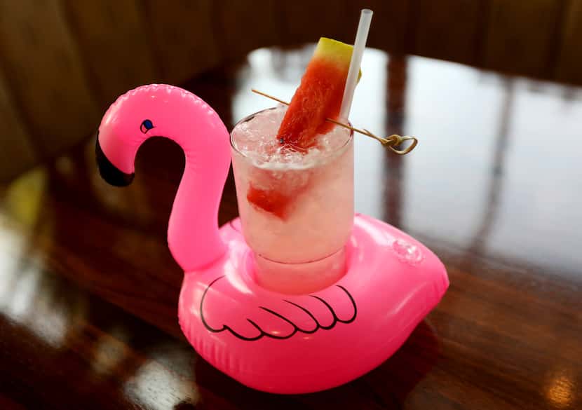 A drink with a blow-up floatie, named the Basic Beach? Gimme. It's available at Suburban...