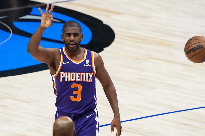 Phoenix Suns guard Chris Paul (3) reacts after being fouled by Dallas Mavericks forward Maxi...