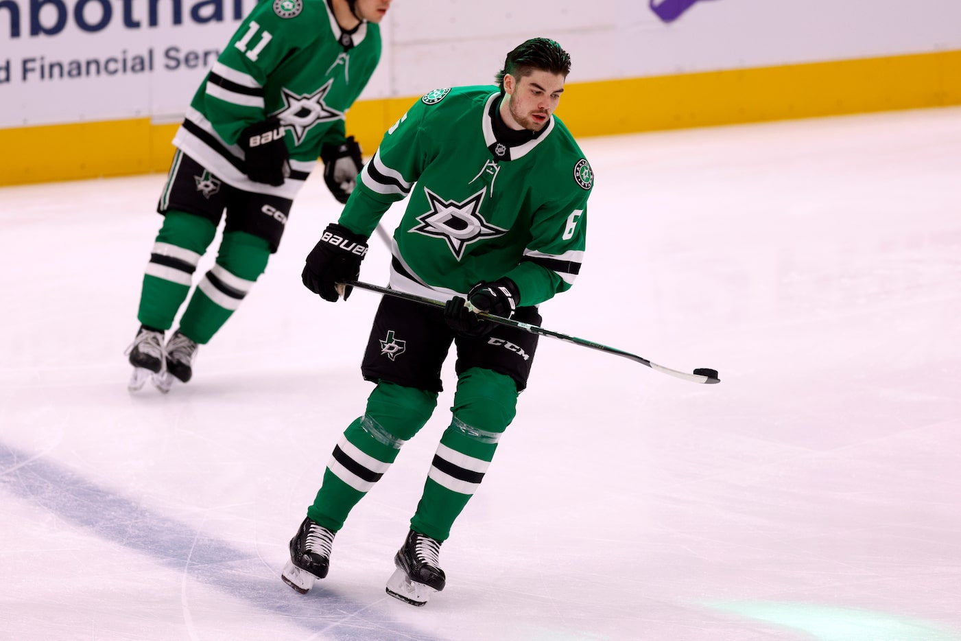 Dallas Stars defenseman Lian Bichsel (6) warms up before making his NHL debut against...