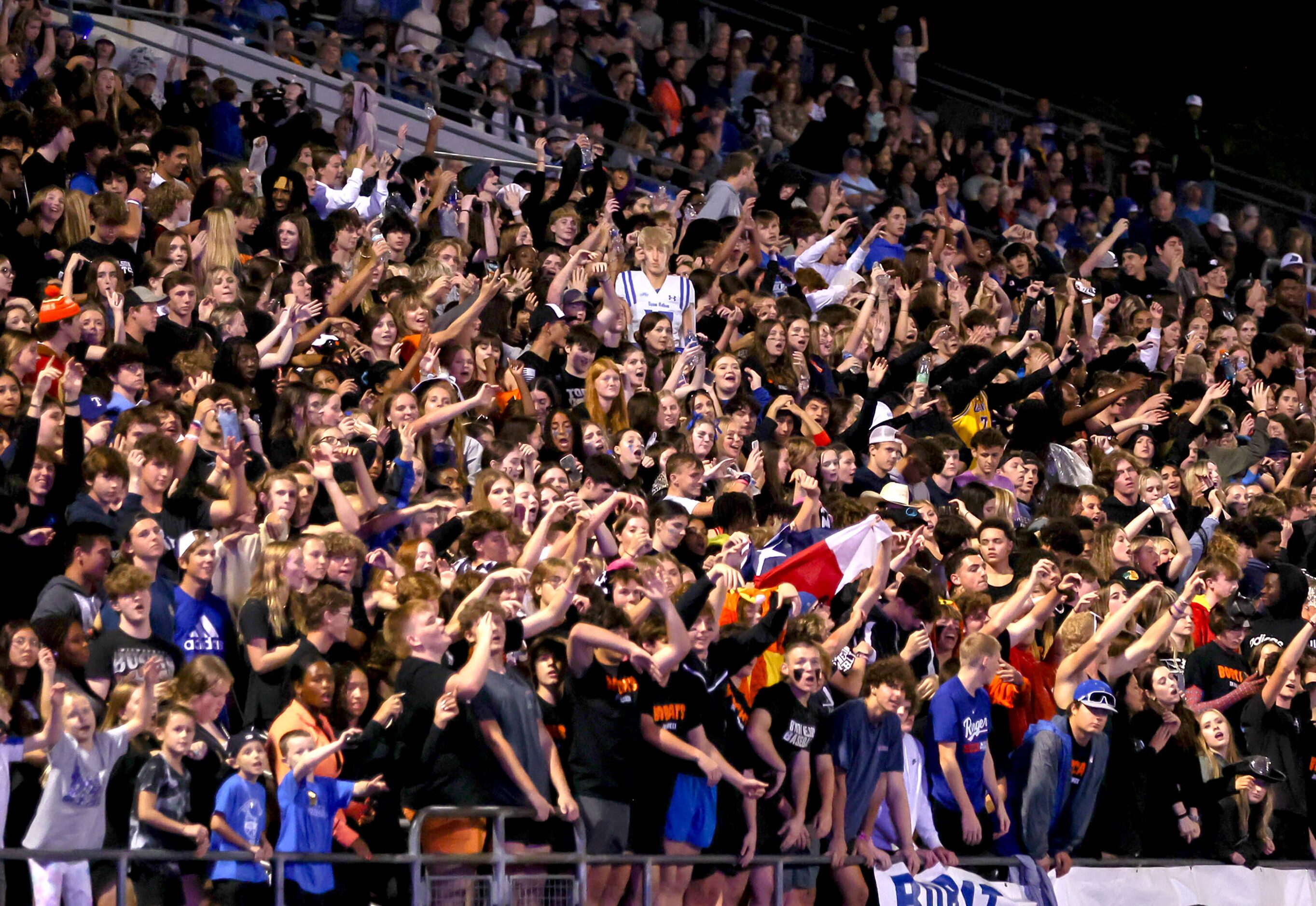 The Byron Nelson crowd cheer on the Bobcats against Southlake Carroll in a District 4-6A...