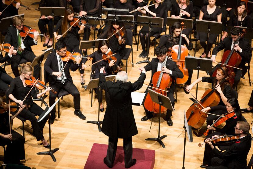 Conductor Paul Philips conducts student members of the Meadows Symphony Orchestra performing...