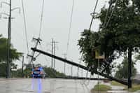 Garland police block traffic due to a downed power line near North Garland Avenue and Belt...