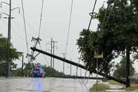 Garland police block traffic due to a downed power line near North Garland Avenue and Belt...