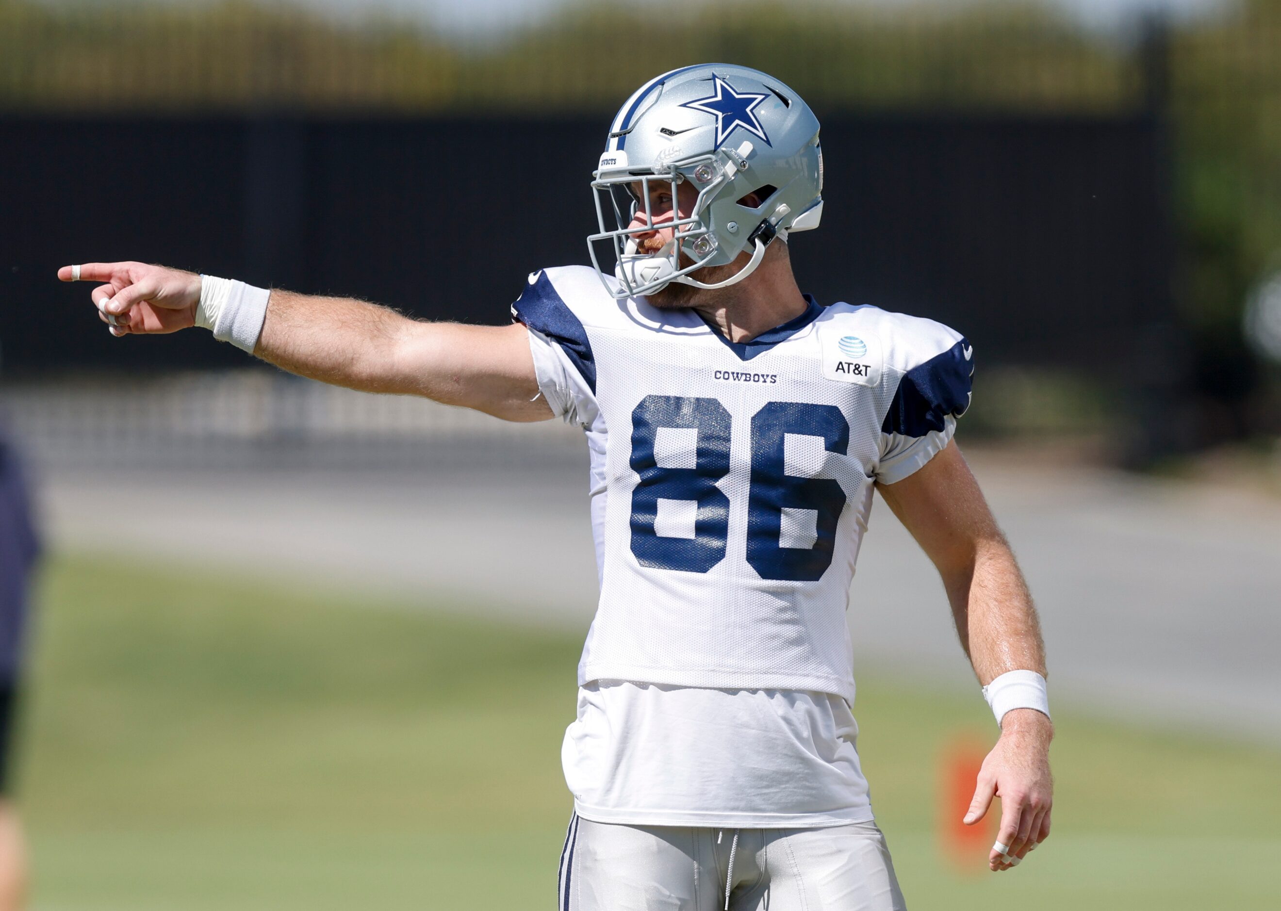 Dallas Cowboys tight end Dalton Schultz (86) points to a teammate during a practice at The...