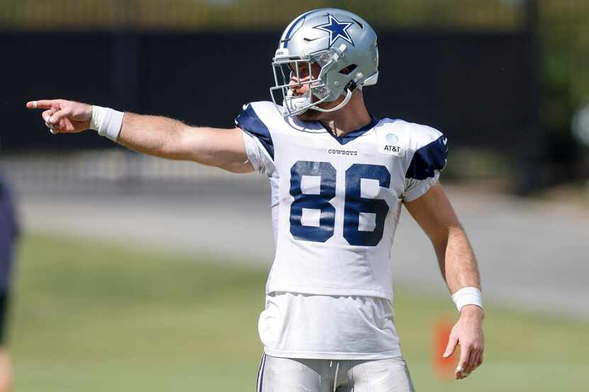 Dallas Cowboys tight end Dalton Schultz (86) points to a teammate during a practice at The...