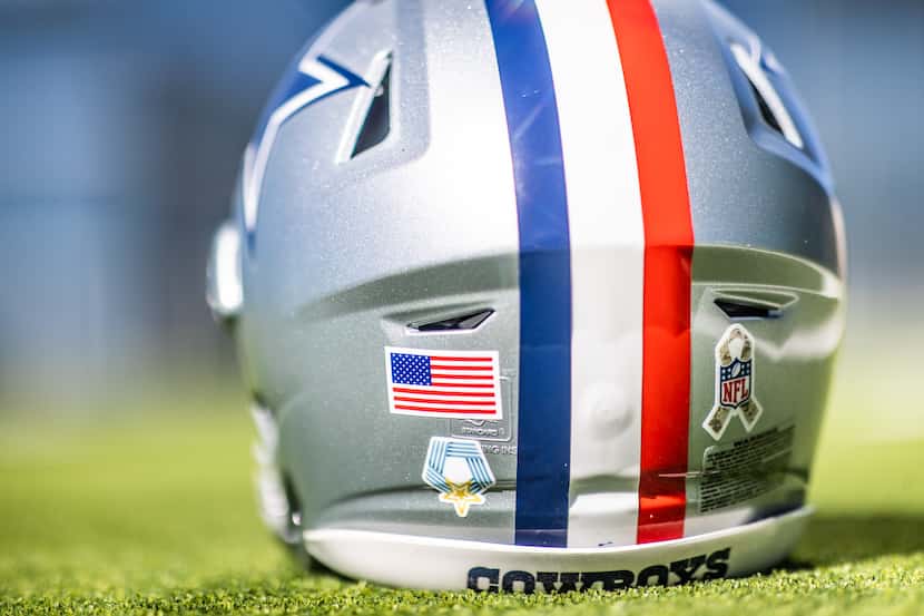 A look at the decals on the back of the Dallas Cowboys' red stripe helmet for Sunday's game.