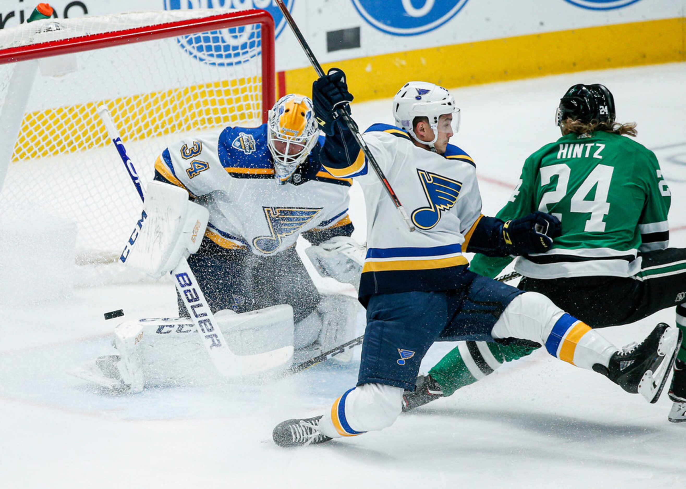 Dallas Stars forward Roope Hintz (24) attempts a backhand shot as St. Louis Blues goaltender...