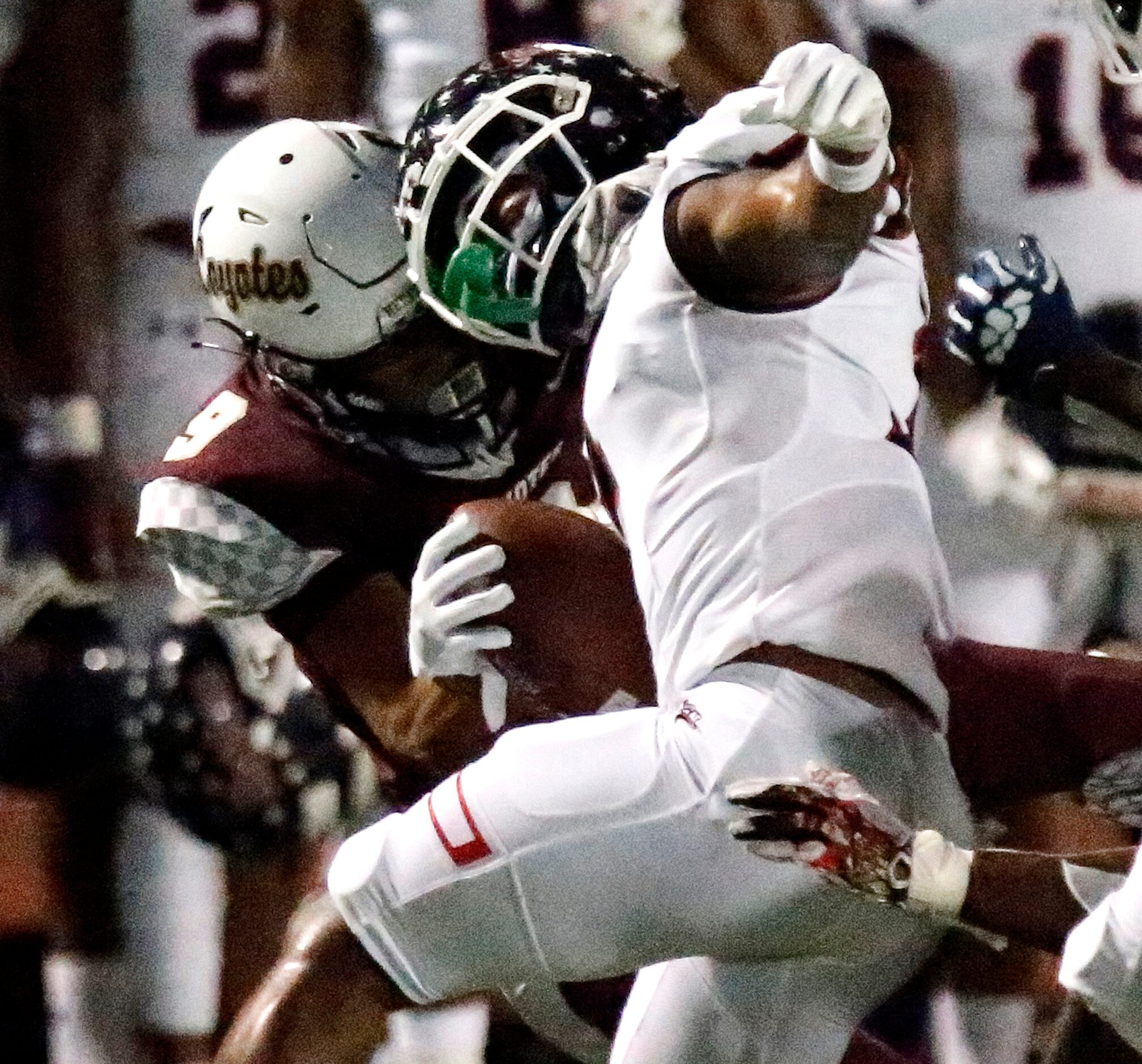 Denton Ryan High School wide receiver Garyreon Robinson (7) is tackled by Frisco Heritage...