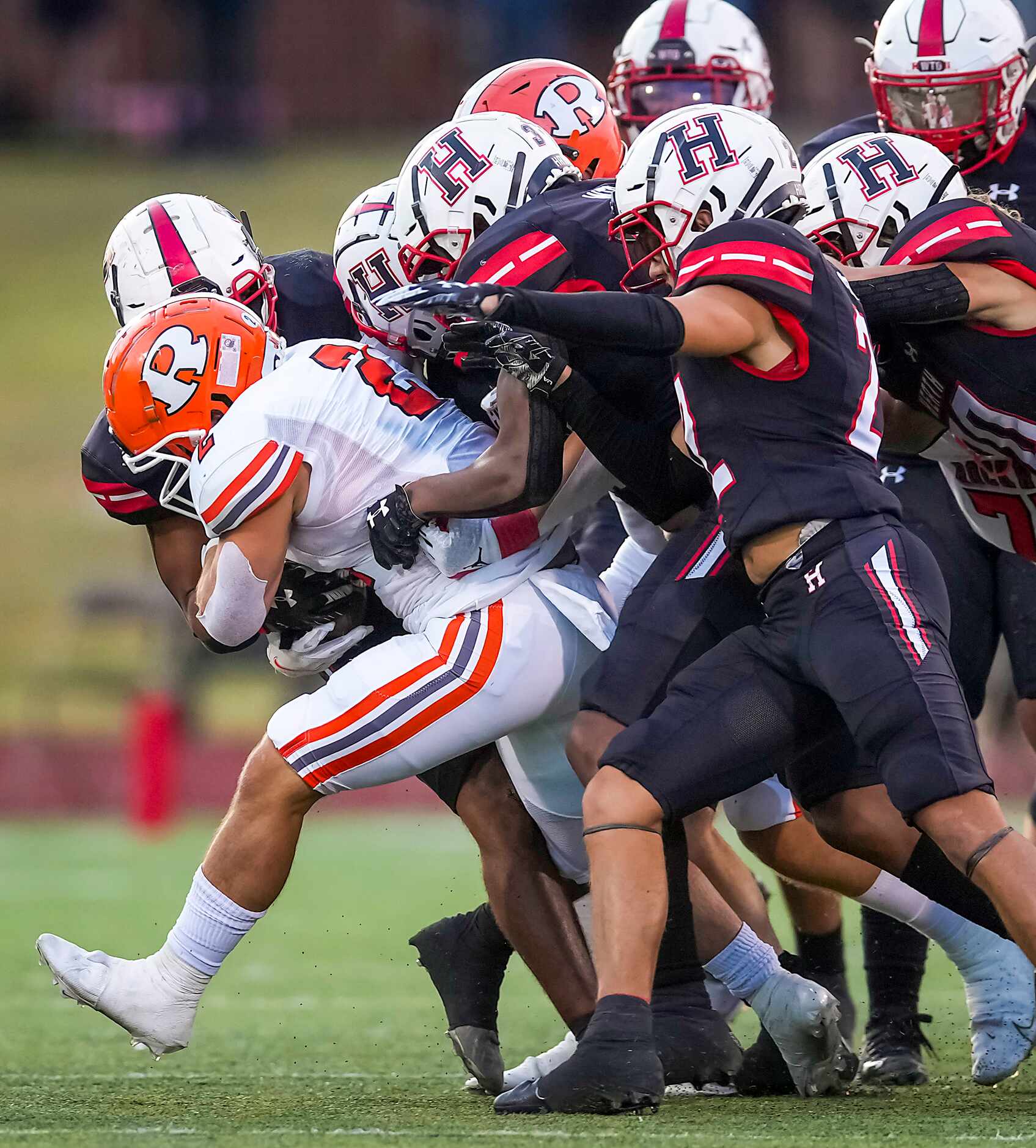 Rockwall running back  Zach Hernandez (2) is brought down by the Rockwall-Heath defense...