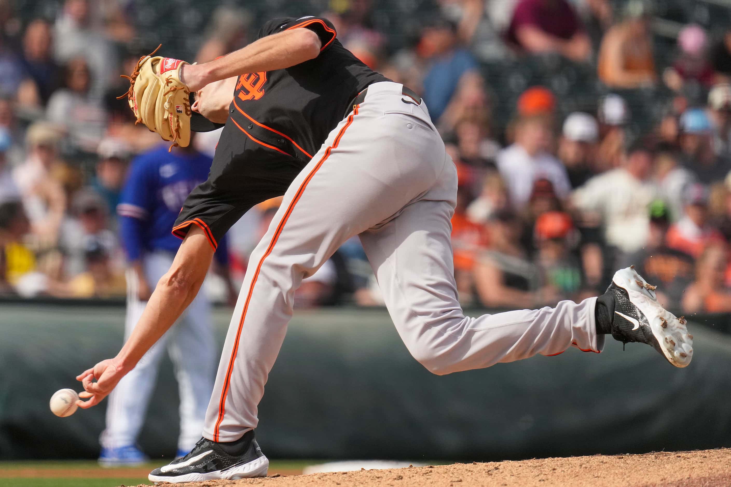 San Francisco Giants pitcher Tyler Rogers delivers during the fourth inning of a spring...
