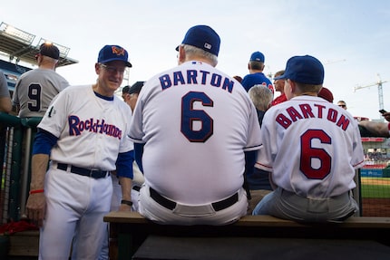 Rep. Mike Conaway, R-Texas, left talks with Rep. Joe Barton, R-Texas, and his son Jack, 12,...