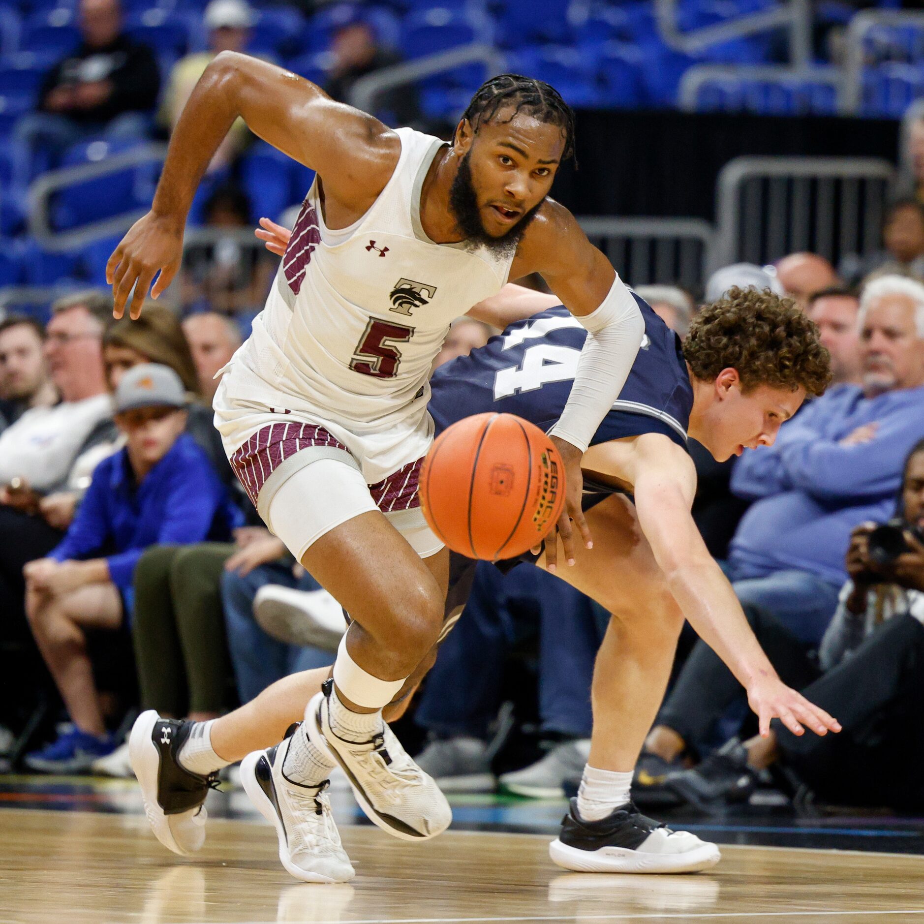 Mansfield Timberview guard Jared Washington (5) steals the ball from Boerne Champion guard...