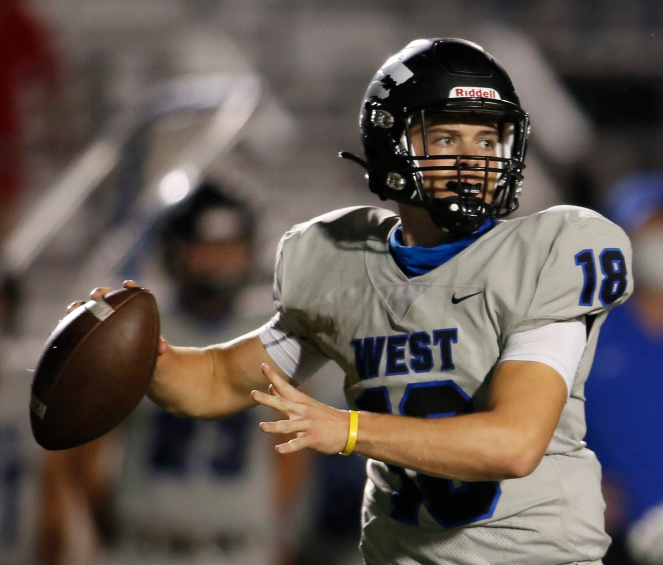 Plano West quarterback Greg Draughn (18) stands strong in the pocket as he prepares to...