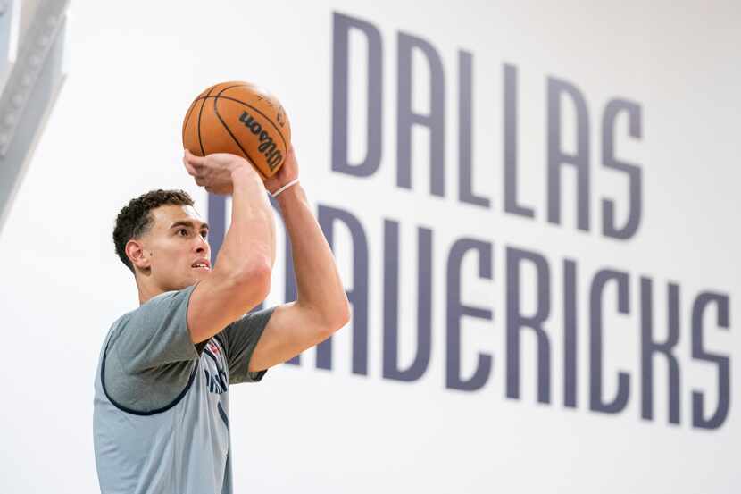 Dallas Mavericks center Dwight Powell (7) shoots a 3-pointer during the first practice of...