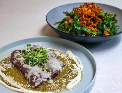The Tipsy Chicken enchilada plate and the Arugula and Carrot Salad are two menu items at...