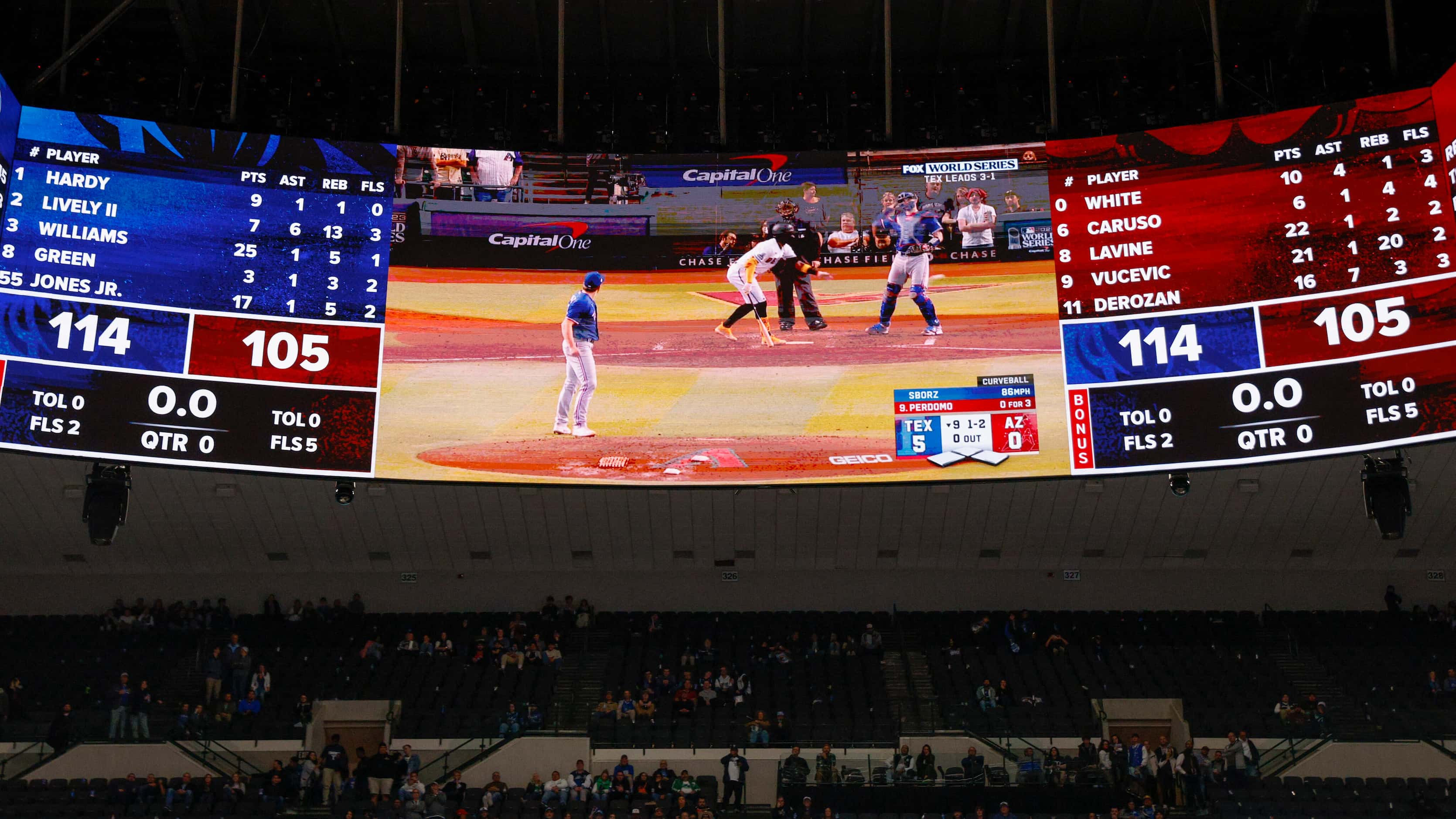 The video board at the American Airlines center shows Game 5 of the World Series between the...