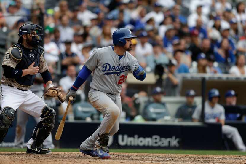 Los Angeles Dodgers' Adrian Gonzalez hits a two-RBI single against the San Diego Padres...