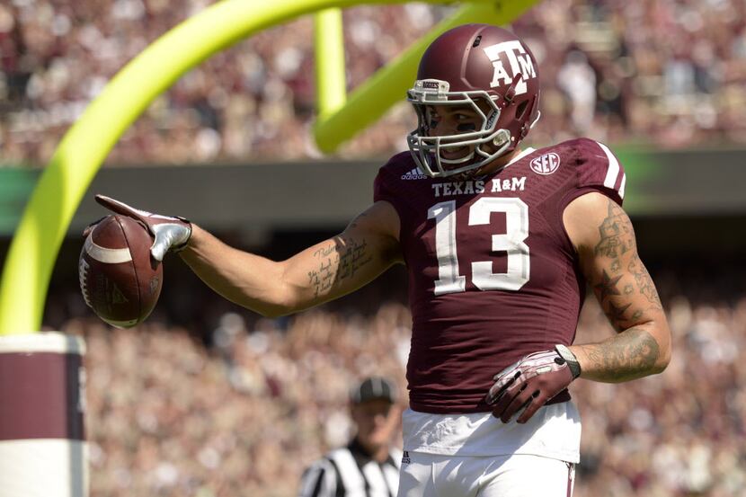 Texas A&M Aggies wide receiver Mike Evans (13) celebrates scoring a touchdown against the...