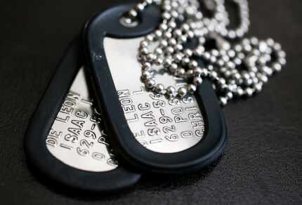 The dogtags of Pfc. Isaac L. DeLeon, who died in a flooding accident during a training...