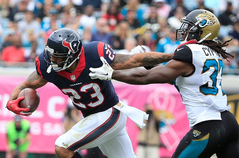 JACKSONVILLE, FL - OCTOBER 18: Johnathan Cyprien #37 of the Jacksonville Jaguars attempts to...