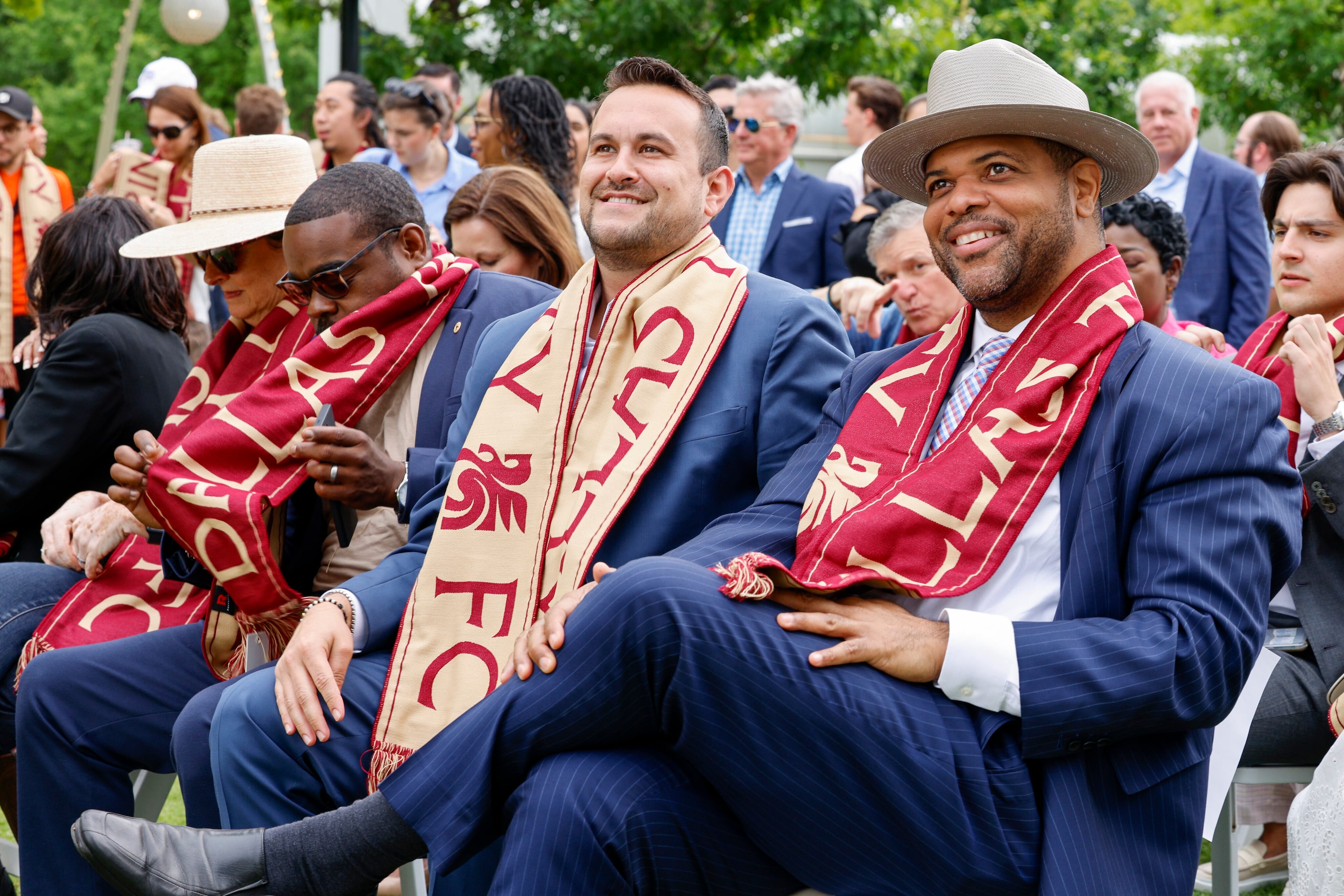 Dallas Mayor Eric Johnson (right) and council member Adam Bazaldua smile as they wear Dallas...