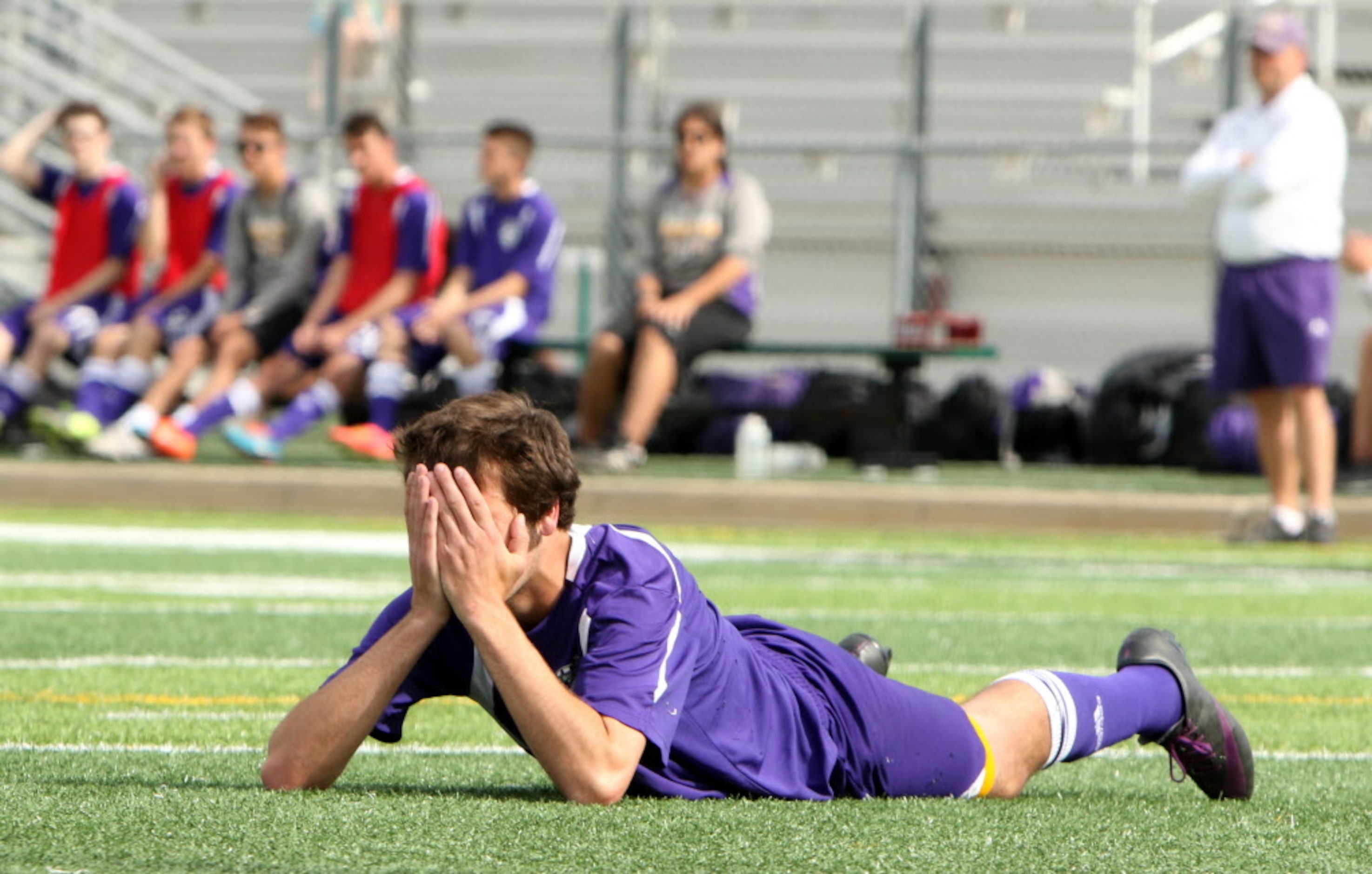 Abilene Wylie's Anson Van Cleave (13) shows the frustration as does the team bench after...