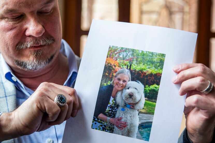 Scott Kakacek looks at a photo of his late mother, Norma "Rae" Kakacek, while at his office...