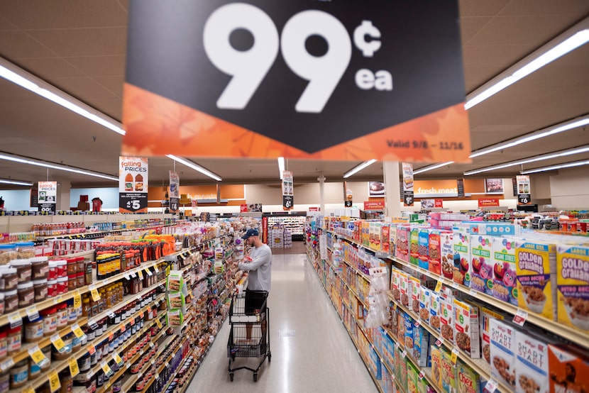 Brad Seaton shops in the bread and cereal aisle at the Tom Thumb grocery store on Custer...