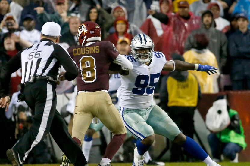 Dallas Cowboys defensive tackle David Irving (95) tackles Washington Redskins quarterback...