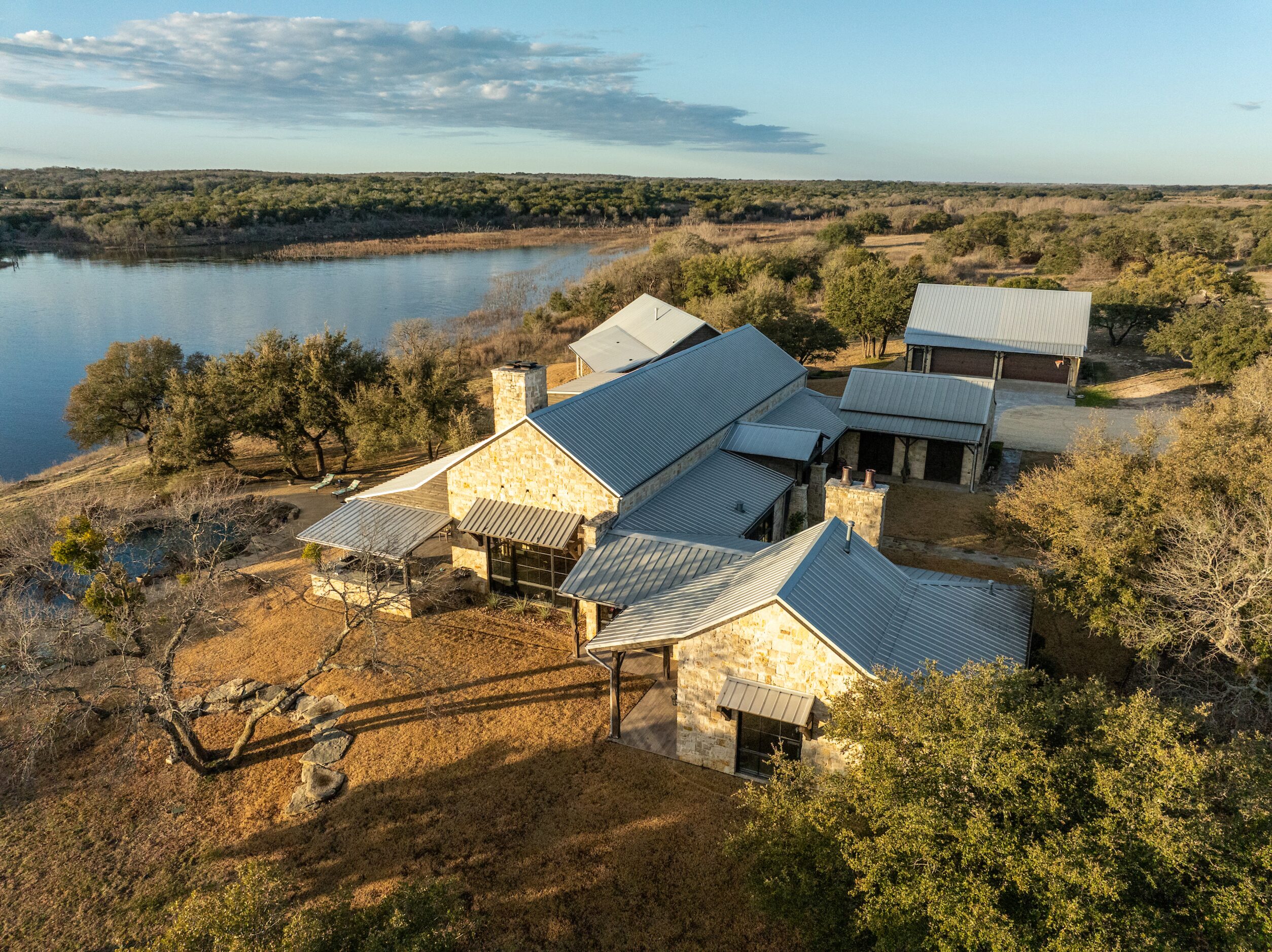 The custom-built lodge - with five bedrooms, five bathrooms, and two half-baths - has an...