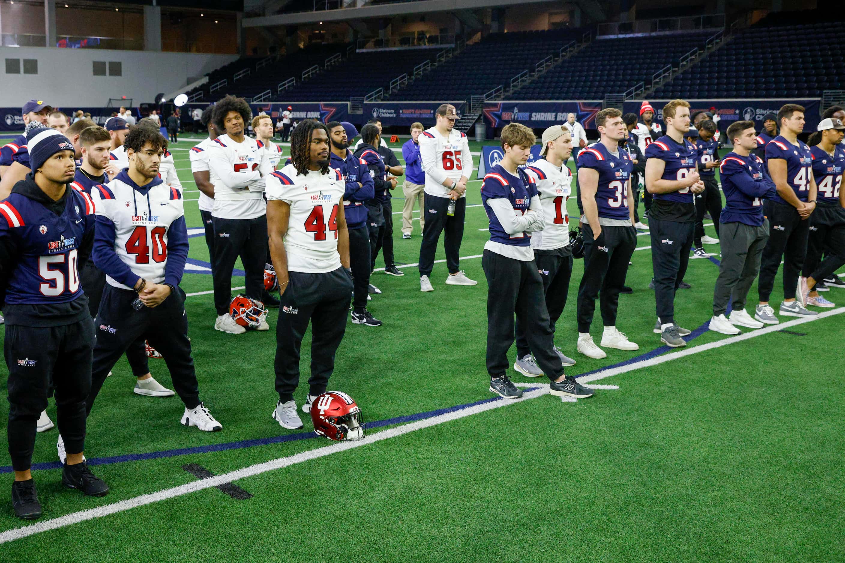 East-West Shrine Bowl players watch as former NFL wide receiver Steve Smith and Texas...